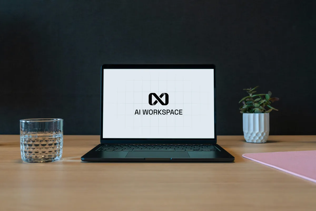 Laptop displaying an AI workspace interface in a modern office.